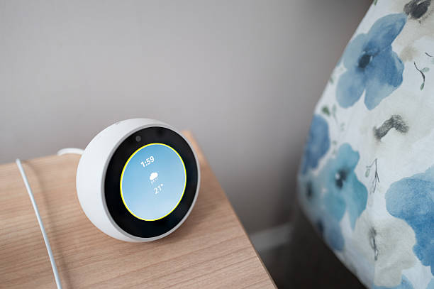 istock Wireless connected smart home device showing the current weather on its OLED display. 2233527191