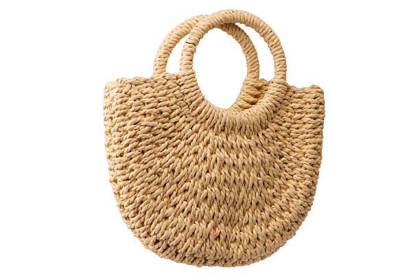 istock A beige straw bag isolated on a white background. 2233528069