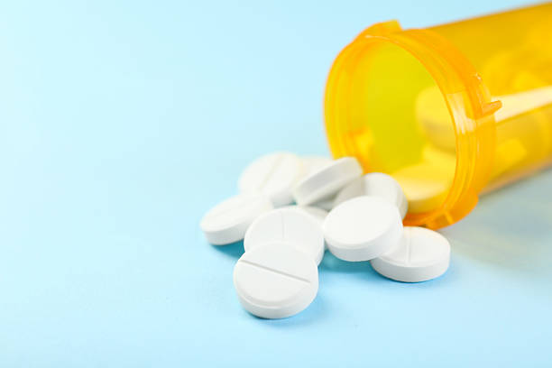 istock Bottle of antibiotic pills on light blue background, closeup. Space for text 2233528191