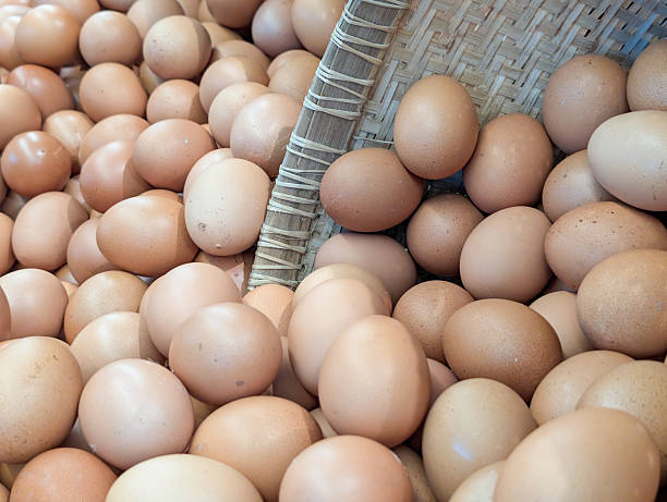 istock Fresh chicken eggs in bamboo basket 2233528966