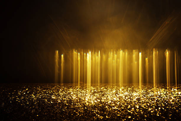 istock abstract glitter gold and black lights background. de-focused 2233529296
