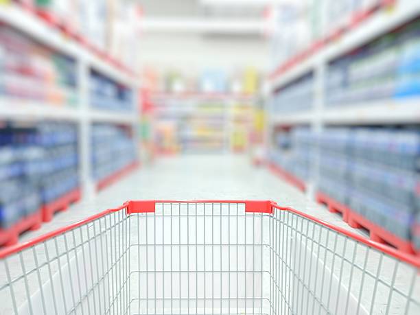 istock Shopping carts in supermarket aisles 2233530436