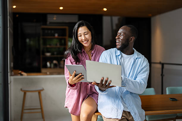 istock A happy, multi-national couple who are digital nomads and work from a different country every month 2233536489