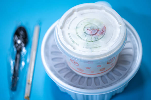 Kalguksu in a plastic box on a blue background. Food delivery. High quality photo