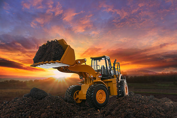 istock Wheel loader   are digging the soil in the construction site. 2233537299