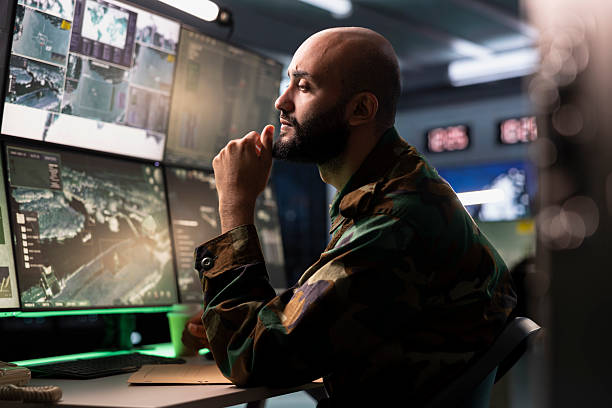 istock Air defense operative in war room using radar to detect ballistic missiles 2233538570