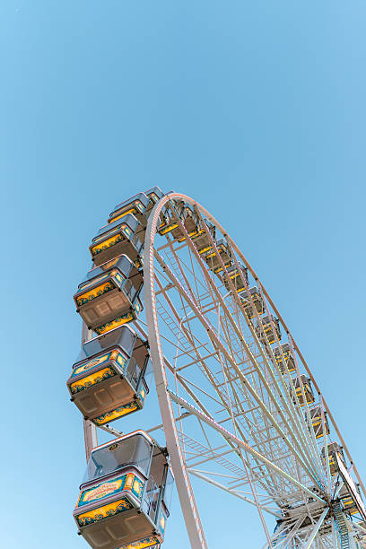 istock Ferris wheel gondolas with colorful details in sunlight 2233538663