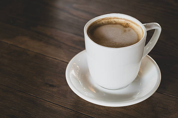 istock Hot latte coffee in white cup. Dark background. 2233538752
