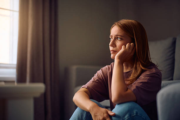 istock Sad woman thinking of something at home. 2233539193