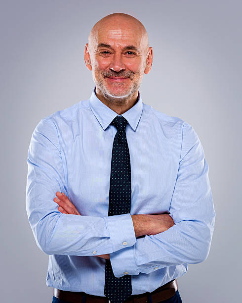 istock Senior man portrait against isolated background 2233539443