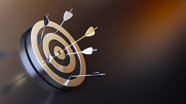istock Golden Tip Arrow Hitting the Bullseye on a Metallic Target Surface 2233540521