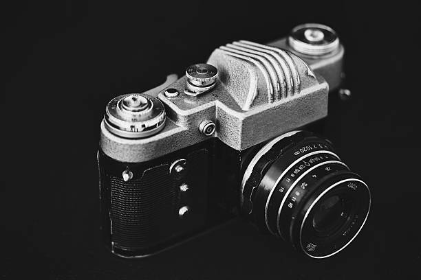 film retro camera on black background