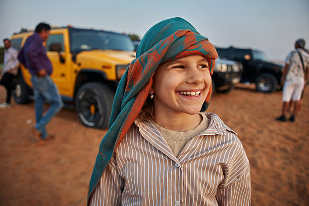 Beautiful girl in Dubai desert. Vacation mood.
