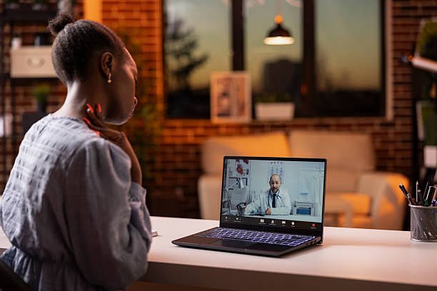 istock Freelancer using laptop to communicate with family doctor from home 2233541078