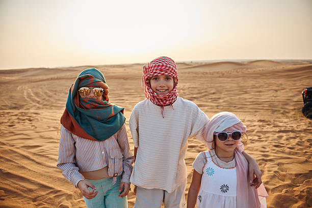 Beautiful children in Dubai desert. Vacation mood.