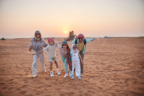 istock Beautiful family in Dubai desert 2233541617