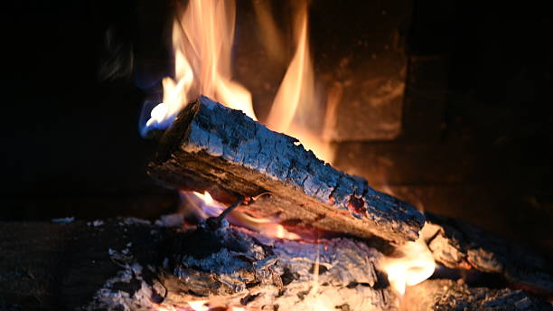 istock Burning Firewood in Fireplace with Glowing Flames 2233541722