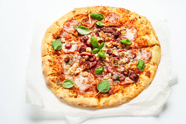 istock Meat pizza with salami, ham and basil. 2233544091