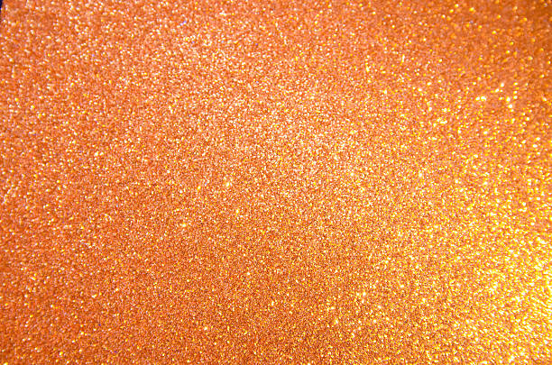 istock Vibrant orange glitter texture creating a festive and energetic celebratory background perfect for dynamic designs. 2233544117