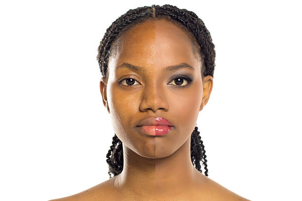 istock Studio shot showing comparison of same black woman before and after makeup on white background. 2233544224