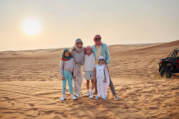istock Beautiful family in Dubai desert 2233544566