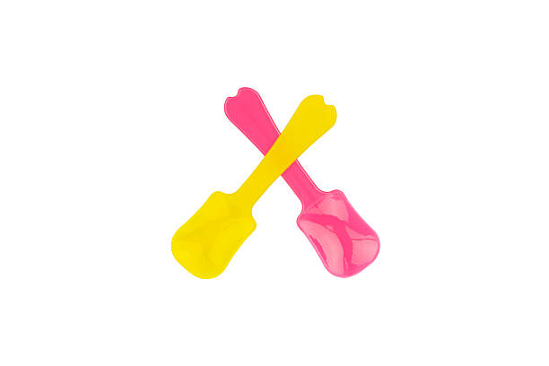 istock Pink and yellow plastic mini spatula for cosmetic cream or kitchen baking tool, isolated on white background with clipping path. 2233544695