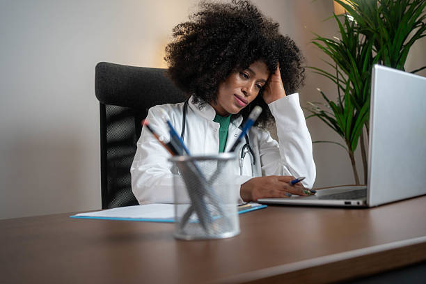istock Female doctor having a headache while being at doctor's office 2233544877