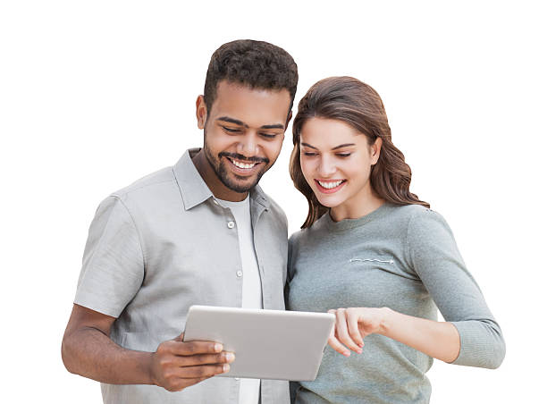 istock Happy couple using digital tablet, isolated on white background 2233545670