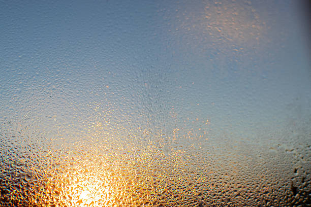 istock Sunrise shot behind glass filled with dew drops, abstract image, Kanchenjunga mountain range in the morning, Ravangla, Sikkim. Scenic view of great Himalaya, India, 2233547248