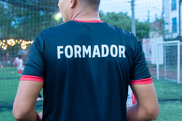 istock A coach is wearing a T-shirt with a sign on the back 2233548624