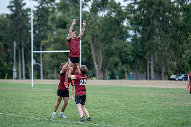 Fullback on a New Zealand club rugby team has his kick charged down by an opposition team member.