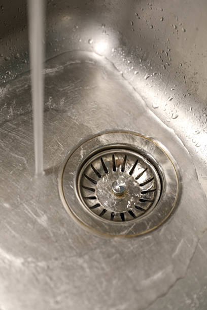 istock Kitchen Hygiene Concept With Clean Shiny Sink And Drain 2233550133