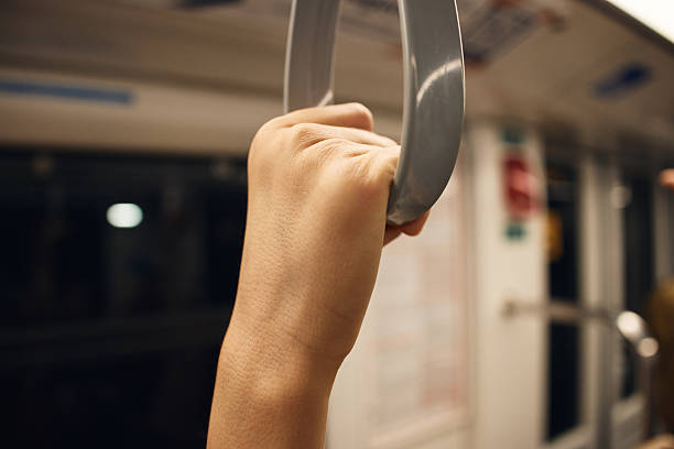 istock Person standing in bus 2233553742