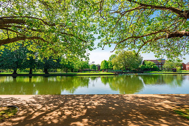 Bedford riverside gardens reflecting summer greenery in calm waters