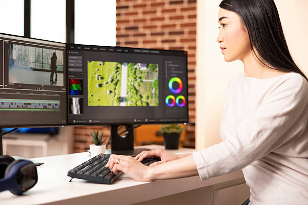 istock Asian woman working remotely on film documentary 2233555687