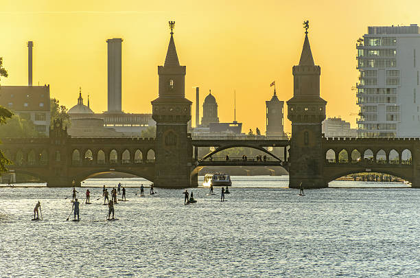 Stand up paddling in Berlin on the River Spree at the Oberbaum Bridge
