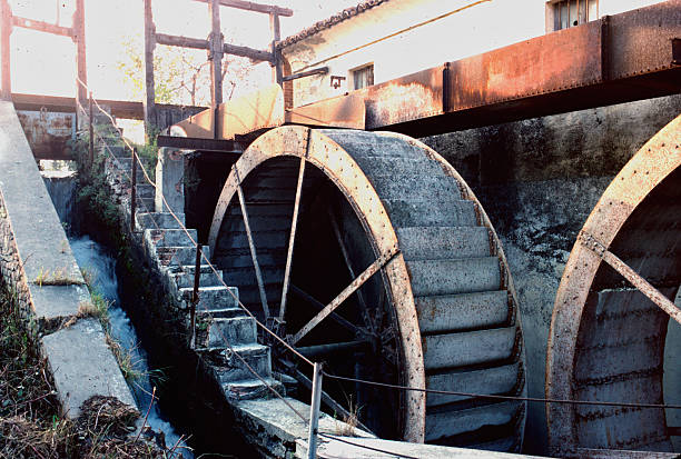 analogic photo of old watermill wheels