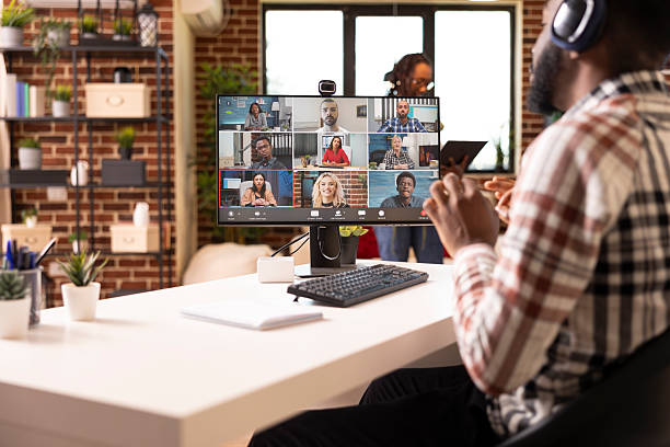 istock Male professional talking with coworkers on computer 2233559233