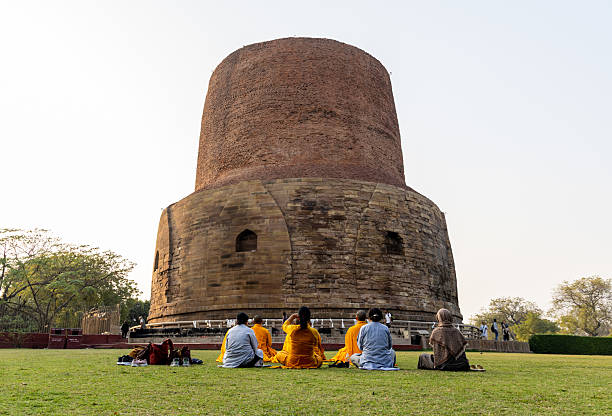 devotees performing sacred worship scene at dhamek stupa heritage site in sarnath image is taken at Sarnath museum, Sarnath uttar pradesh india on Feb 18 2025.