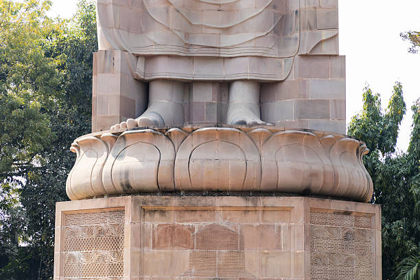 istock foot perspective of ancient buddha sculpture in stone 2233565090