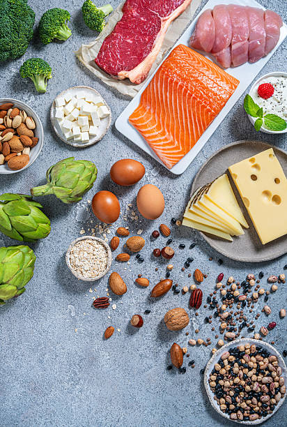 istock Assorted healthy protein source food good for body building: fish, meat, cheese, beans, eggs. 2233568633