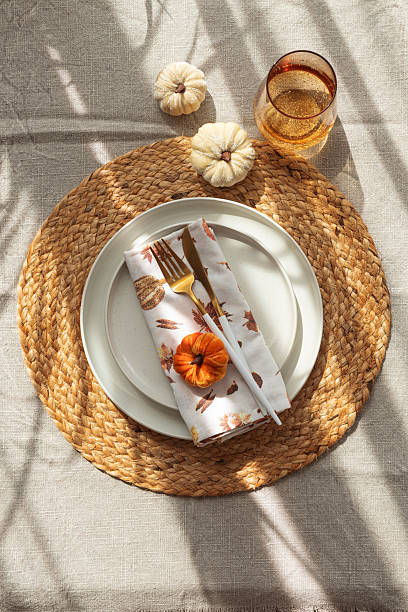 istock Autumn Table Setting with Decorative Pumpkins and Seasonal Leaves 2233571264