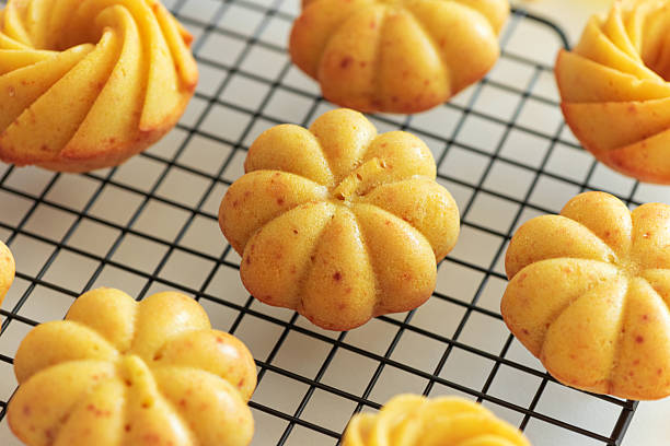istock Autumn-Themed Mini pumpkin Cakes with Seasonal Decorations on White Background 2233571273