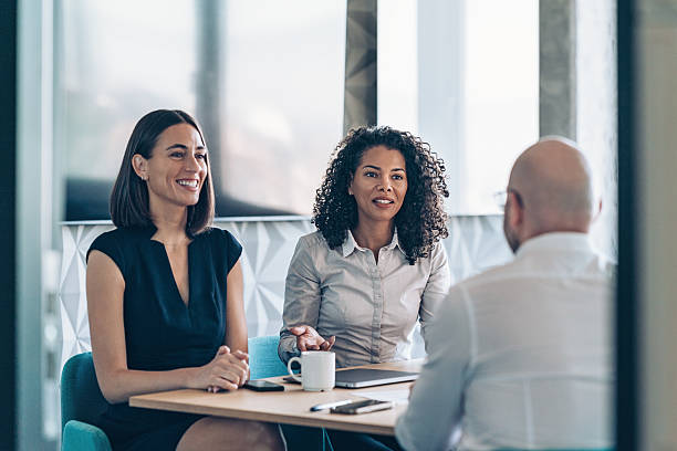 istock View through an open office door to a business team having a conversation 2233574171