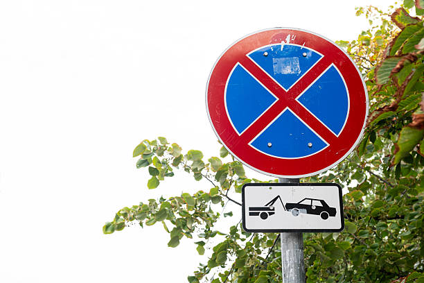 istock No parking zone with towing warning. 2233576903