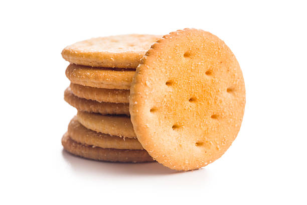istock Crispy round salted crackers isolated on white background. 2233578008