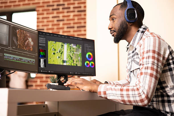 istock Sound editor with headphones working on cinematic content 2233581072