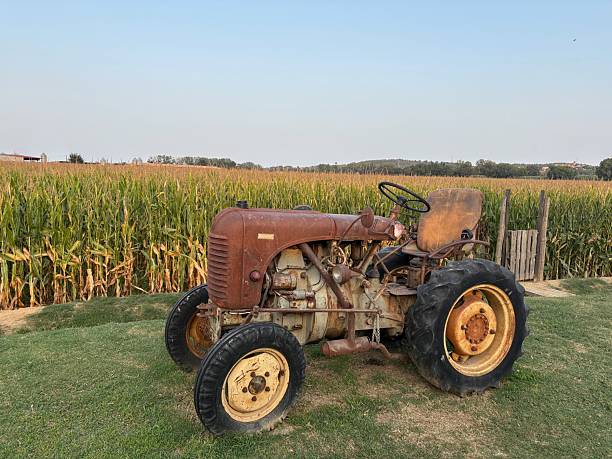 istock Old rusty tractor on a beautiful corn field landscape in Girona, Catalonia 2233584561