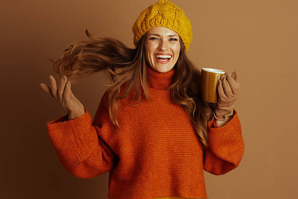istock Vibrant Woman Laughing with Warm Autumn Mug 2233585957