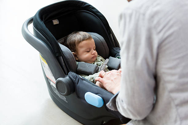 istock Peaceful Baby Sleeping in Infant Car Seat 2233586085